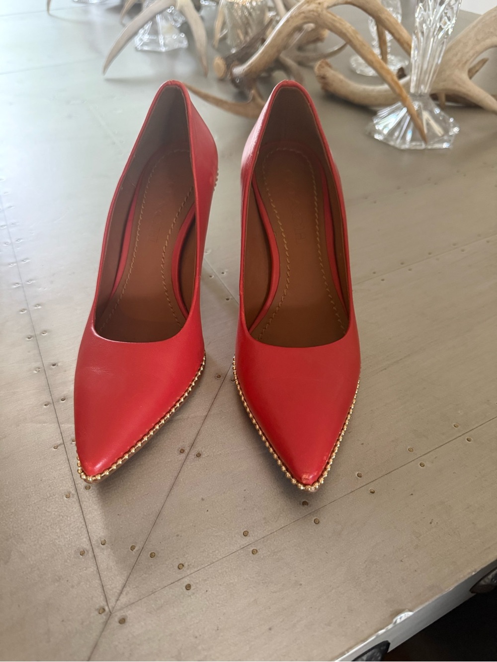 Coach Orange Pointed Toe Pumps with Gold Beaded Trim